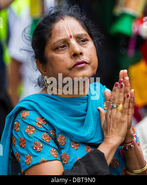 Leicester, UK, 4th August 2013.  A Hare Krishna follower during the Rathayatra street festival in Leicester's City Centre.   Three 40ft chariots were hand pulled through the City, accompanied by dance and music.  Rathayatra is a 5,000 year old festival originating in Jagannatha Puri in India. Credit:  Graham Wilson/Alamy Live News Stock Photo