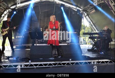 Ayr, UK. 4th Aug, 2013.  Jam at the Dam Music festival in aid of 'Cash for Kids'. The Lounge Lizards performing one of their songs at the music festival. Credit:  Maurice Morwood/Alamy Live News Stock Photo