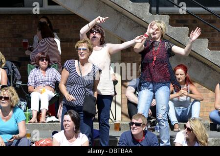 Ayr, UK. 4th Aug, 2013.  Jam at the Dam Music festival in aid of 'Cash for Kids'. Crowd participation during one of the acts at the charity music festival. Credit:  Maurice Morwood/Alamy Live News Stock Photo