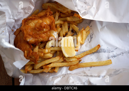 Fish, chips  in paper wrapping from restaurant at Kalk Bay Harbour near Cape Town Stock Photo