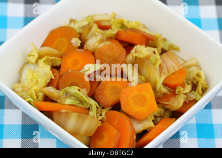 Bowl of stir fried chinese leaf and carrots in soy sauce Stock Photo