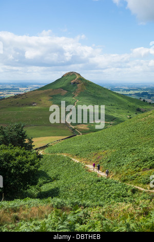 Hikers walking up to Newton Moor from Roseberry Topping (in background), North York Moors National Park. England, UK Stock Photo