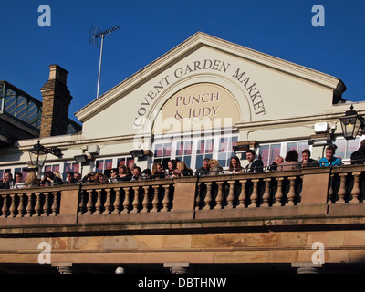 People Socializing On The Balcony Bar of The Punch a Judy, At Covent Garden Market Westminster London United Kingdom England Stock Photo