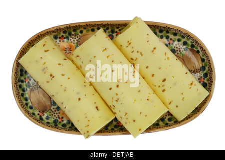 Cheese with cumin seeds isolated on white Stock Photo