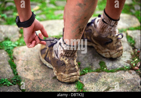 Muddy trainers Stock Photo