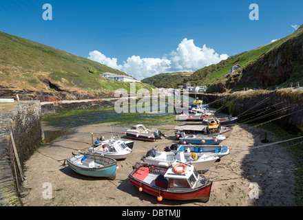 Fishing boats at low tide in Boscastle harbour in Cornwall Stock Photo