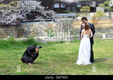 A newly married couple in Japan having their photo taken. Stock Photo
