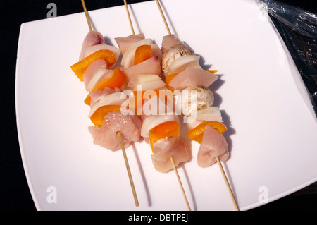 Raw Uncooked Skewered Chicken and Vegetable Kebabs Ready for the Bar B Q Stock Photo