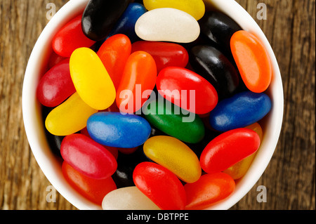 Jelly Beans in a bowl on wooden background Stock Photo