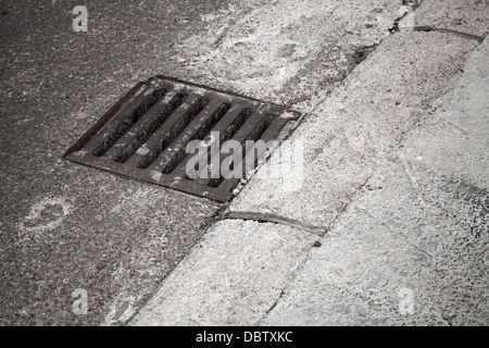 Drainage cover on the road side Stock Photo