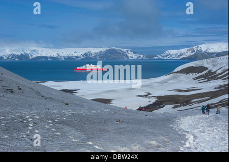 Cruise ship anchoring in the volcanic crater of Deception Island, South Shetland Islands, Antarctica, Polar Regions Stock Photo