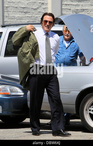 Frank Stallone seen trying on an army jacket in a parking lot in Beverly Hills Beverly Hills, California - 27.08.11 Stock Photo