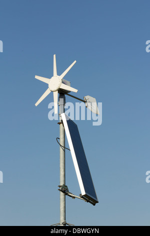 A hybrid solar and wind turbine power generator. This particular small unit is used to power roadside equipment. Stock Photo