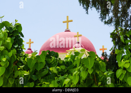 Christian Greek Orthodox Church of the Seven Apostles in Capernaum (Israel) in natural foliage frame Stock Photo