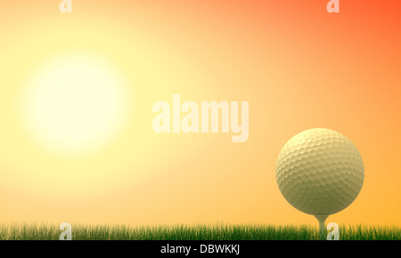 Golf ball with tee in the grass at sunset Stock Photo