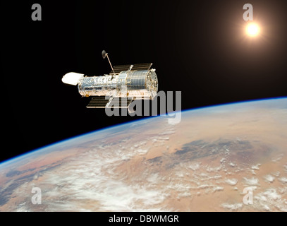 Hubble telescope hovers 350 miles above earth photographing for space exploration Stock Photo