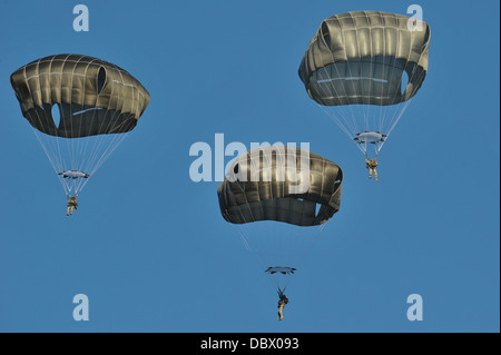 US Army Paratroopers conduct Airborne operations with T-11 parachutes from a C-130 Hercules at the Grafenwoehr Training Area August 1, 2013 in Grafenwoehr, Germany. Stock Photo
