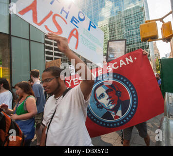 New York, New York. 04th Aug, 2013. Protesters in midtown Manhattan in New York demonstrate against the National Security Agency's surveillance of Americans' email and telephone conversations on Sunday, August 4, 2013. The protest was organized by a group called 'Restore the Fourth' referring to the Fourth Amendment of the Constitution which protects citizens against unreasonable searches by the government. Many citizens are opposed to the NSA activities and the events which took place around the country were called '1984 Day'. Credit:  Richard Levine/Alamy Live News Stock Photo