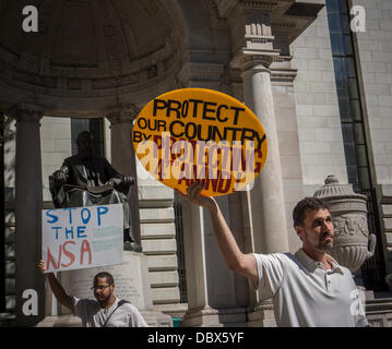 New York, New York. 04th Aug, 2013. Protesters in midtown Manhattan in New York demonstrate against the National Security Agency's surveillance of Americans' email and telephone conversations on Sunday, August 4, 2013. The protest was organized by a group called 'Restore the Fourth' referring to the Fourth Amendment of the Constitution which protects citizens against unreasonable searches by the government. Many citizens are opposed to the NSA activities and the events which took place around the country were called '1984 Day'. Credit:  Richard Levine/Alamy Live News Stock Photo