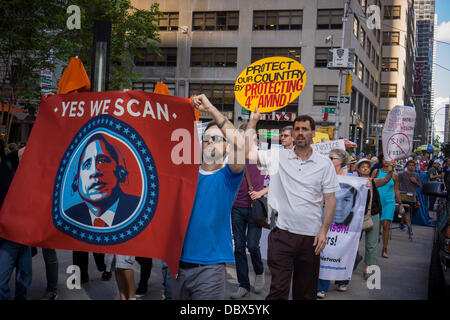 New York, New York. 04th Aug, 2013. Protesters in midtown Manhattan in New York demonstrate against the National Security Agency's surveillance of Americans' email and telephone conversations on Sunday, August 4, 2013. The protest was organized by a group called 'Restore the Fourth' referring to the Fourth Amendment of the Constitution which protects citizens against unreasonable searches by the government. Many citizens are opposed to the NSA activities and the events which took place around the country were called '1984 Day'. Credit:  Richard Levine/Alamy Live News Stock Photo