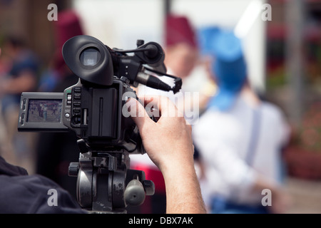 covering an event with a video camera Stock Photo