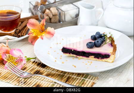 piece of blueberry pie on a table in a restaurant Stock Photo