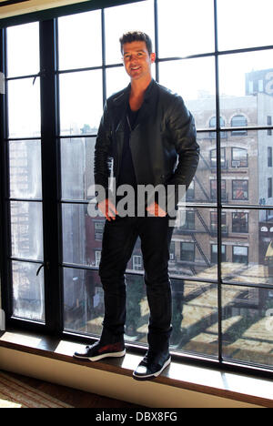 Singer, songwriter and actor Robin Thicke is shown performing on stage ...