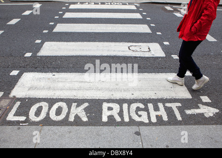 Crosswalks with 'look right' warning, London, UK Stock Photo