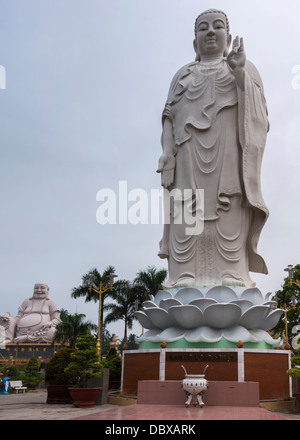 Combination shot of Amitabha statue with Buddha in background. Stock Photo