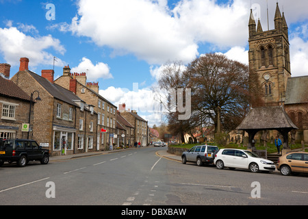 Helmsley, North Yorkshire. Looking up Church St with All Saints Church on the right. Stock Photo