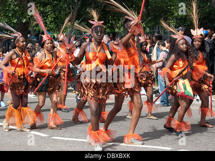 LONDON, ENGLAND - AUGUST 29, 2011:  A street dancers walk at London Notting Hill Carnival on August 29, 2011 in London Stock Photo