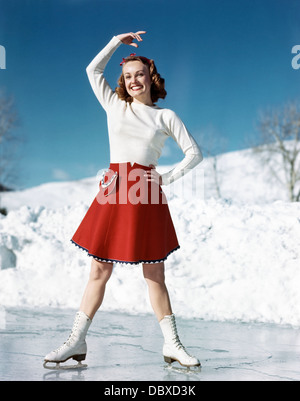 https://l450v.alamy.com/450v/dbxd3k/1950s-smiling-woman-wearing-white-sweater-red-skirt-ice-skating-posing-dbxd3k.jpg