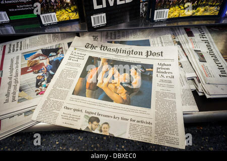 New York, USA. 5th Aug, 2013. The Monday, August 5, 2013 edition of the Washington Post is seen on a newsstand in New York.  Jeff Bezos, the billionaire founder of Amazon, is purchasing the Washington Post Company, including the flaship paper, for a reported $250 million. The purchase is through Bezos and is not affiliated with Amazon. Credit:  Richard Levine/Alamy Live News Stock Photo