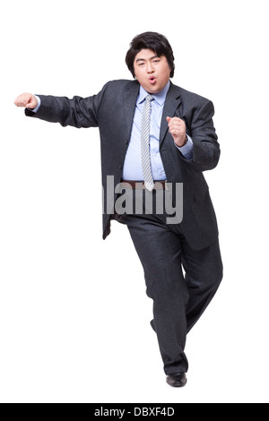 Happy overweight businessman dancing Stock Photo