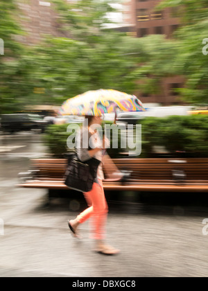 Female Pedestrian with a Colorful Umbrella, NYC, USA Stock Photo - Alamy
