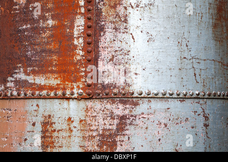 Old rusted metal background texture with rivets Stock Photo