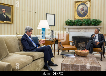 President Barack Obama meets with Secretary of State John Kerry in the Oval Office, July 29, 2013. Stock Photo