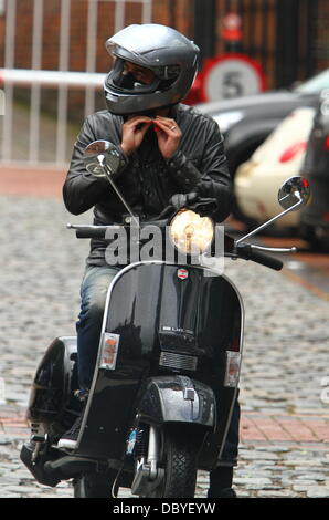 Chris Gascoyne arrives on a scooter 'Coronation Street' cast arriving at the Granada studios Manchester, England - 14.09.11 Stock Photo