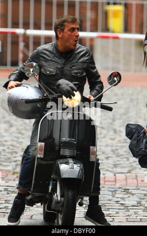 Chris Gascoyne arrives on a scooter 'Coronation Street' cast arriving at the Granada studios Manchester, England - 14.09.11 Stock Photo