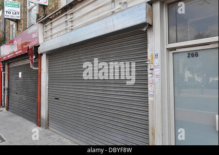 Green Lanes, London, UK. 6th August 2013. Empty shops on Green Lanes, Haringey. There are 7,000 empty shops in London, costing £350m in lost business. Credit:  Matthew Chattle/Alamy Live News Stock Photo