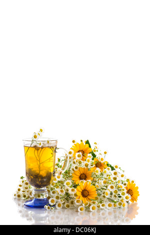 chamomile tea and a bouquet of daisies on a white background Stock Photo