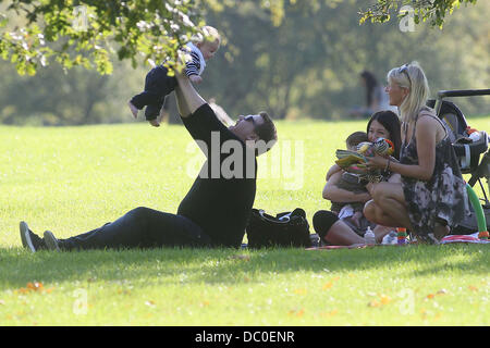 James Corden with baby Max enjoying the sunshine at a park in Primrose Hill. London, England - 28.09.11 Stock Photo