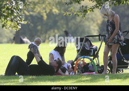 James Corden with baby Max enjoying the sunshine at a park in Primrose Hill. London, England - 28.09.11 Stock Photo