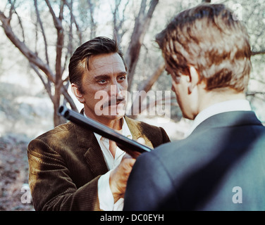 1960s 1968 FILM THE BROTHERHOOD STARRING KIRK DOUGLAS AND ALEX CORD WITH GUN Stock Photo