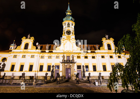 Loreta Sanctuary in Prague, with the Saints statues on the main entrance and with baroque bell tower Stock Photo