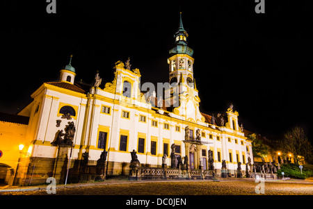 Loreta Sanctuary in Prague, with the Saints statues on the main entrance and with baroque bell tower Stock Photo