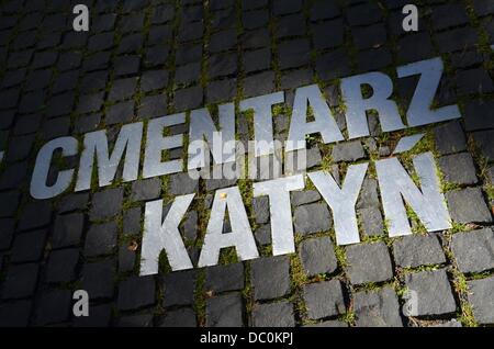 'Katyn Cemetery' is written in Polish on the floor of the Katyn Memorial near Smolensk, Russia, 02 August 2013. During WWII, more than 4,000 Polish intelligence officers and their relatives were executed in Katyn. In total, about 24,000 Polish people were killed. Photo: UWE ZUCCHI Stock Photo