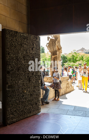 the highly decorated central bronze relief door to La Sagrada Familia Stock Photo