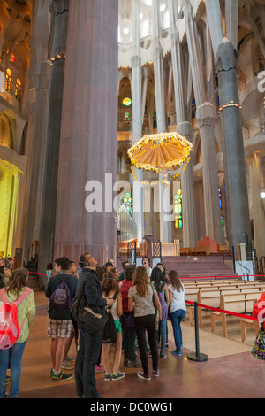 Tourists inside La Sagrada Familia Cathedral Barcelona Stock Photo