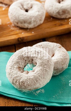 White Homemade Powdered Donuts on a Background Stock Photo